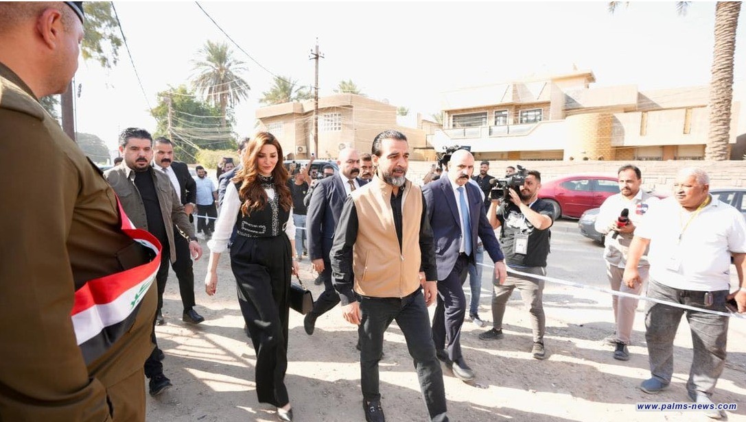 الحلبوسي يصطحب زوجته إلى مركز الاقتراع للمشاركة بالانتخابات